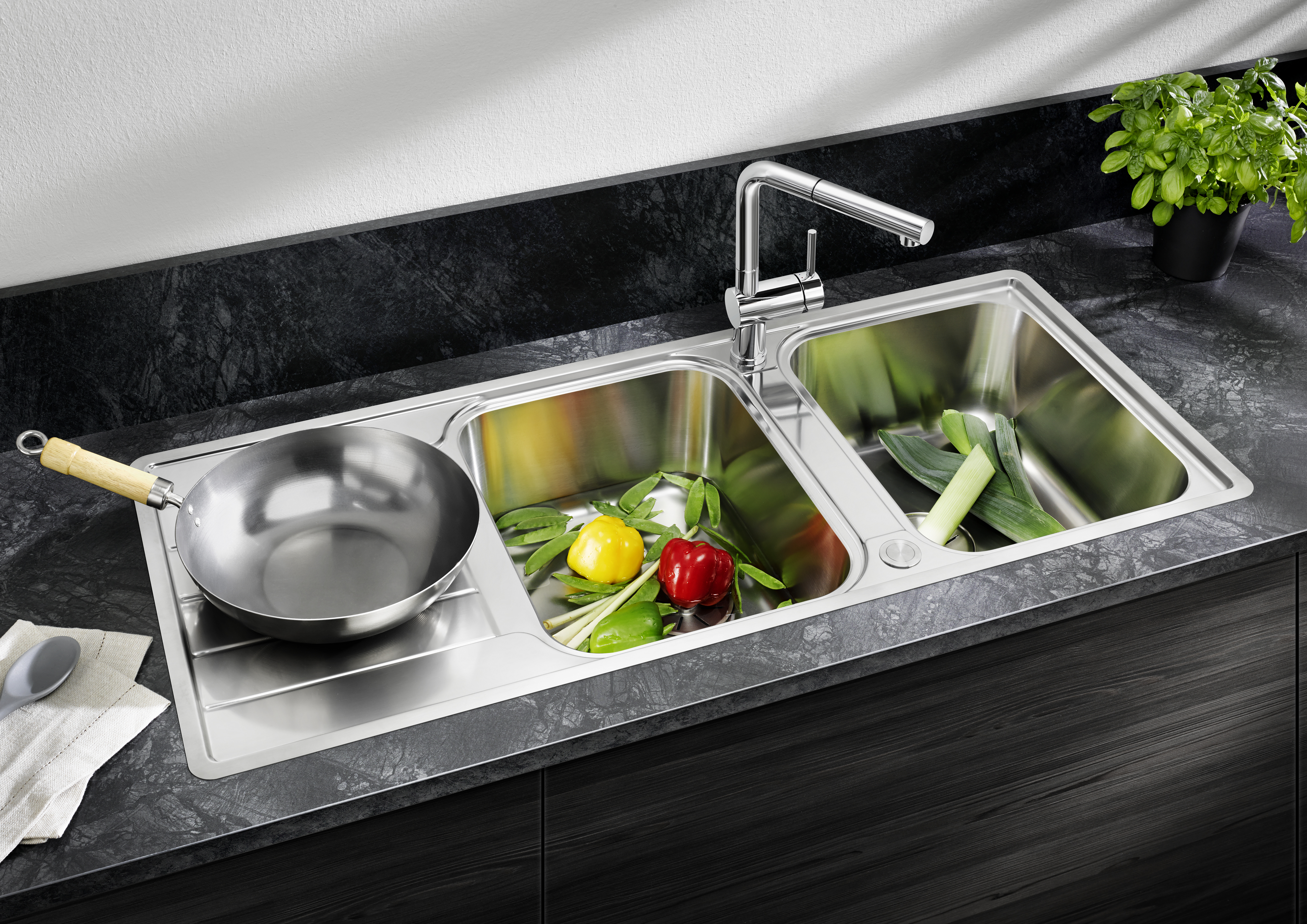 If you have two bowls in your sink, it is advisable to fit the mixer tap in the centre.
