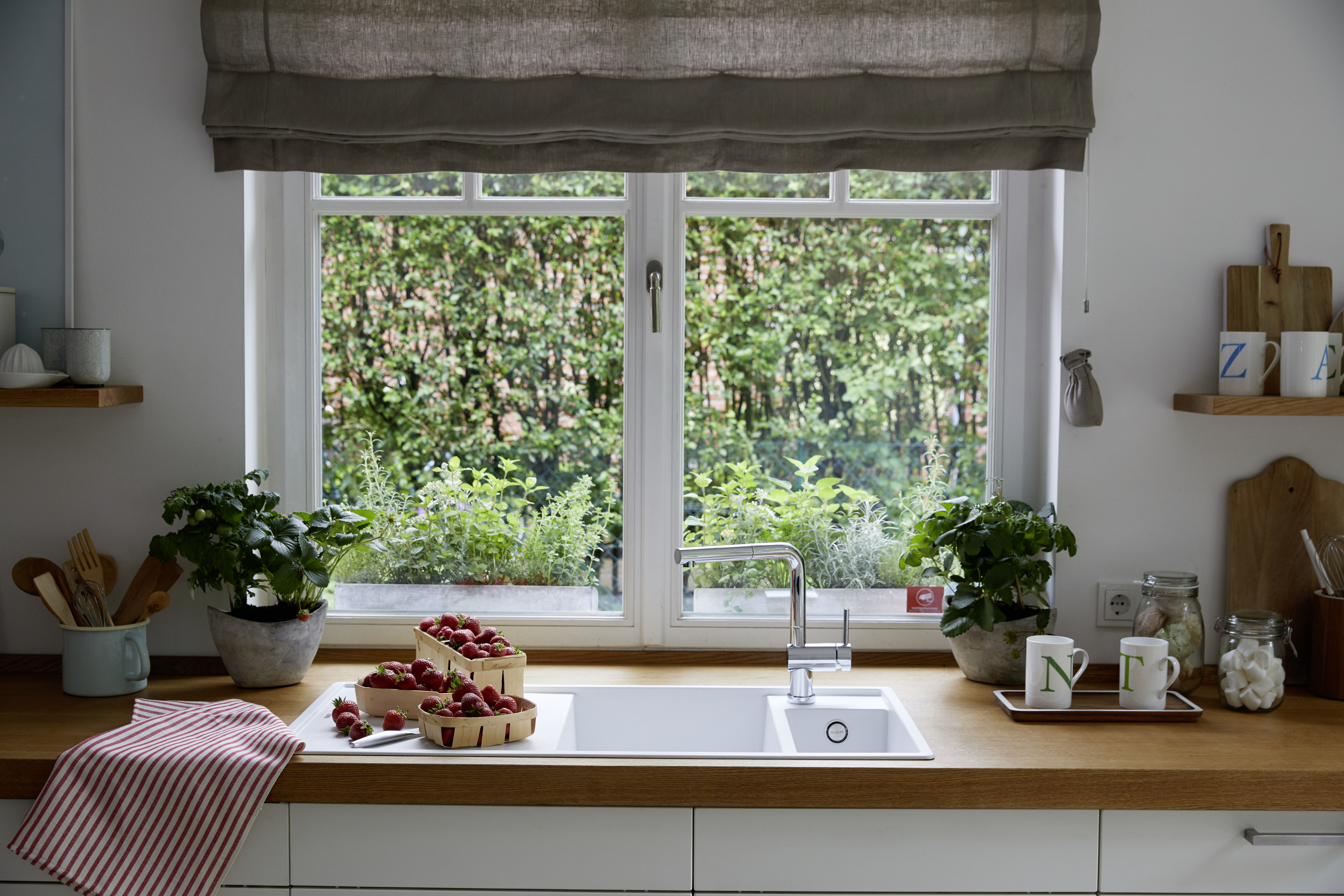 A woman opens the window to air