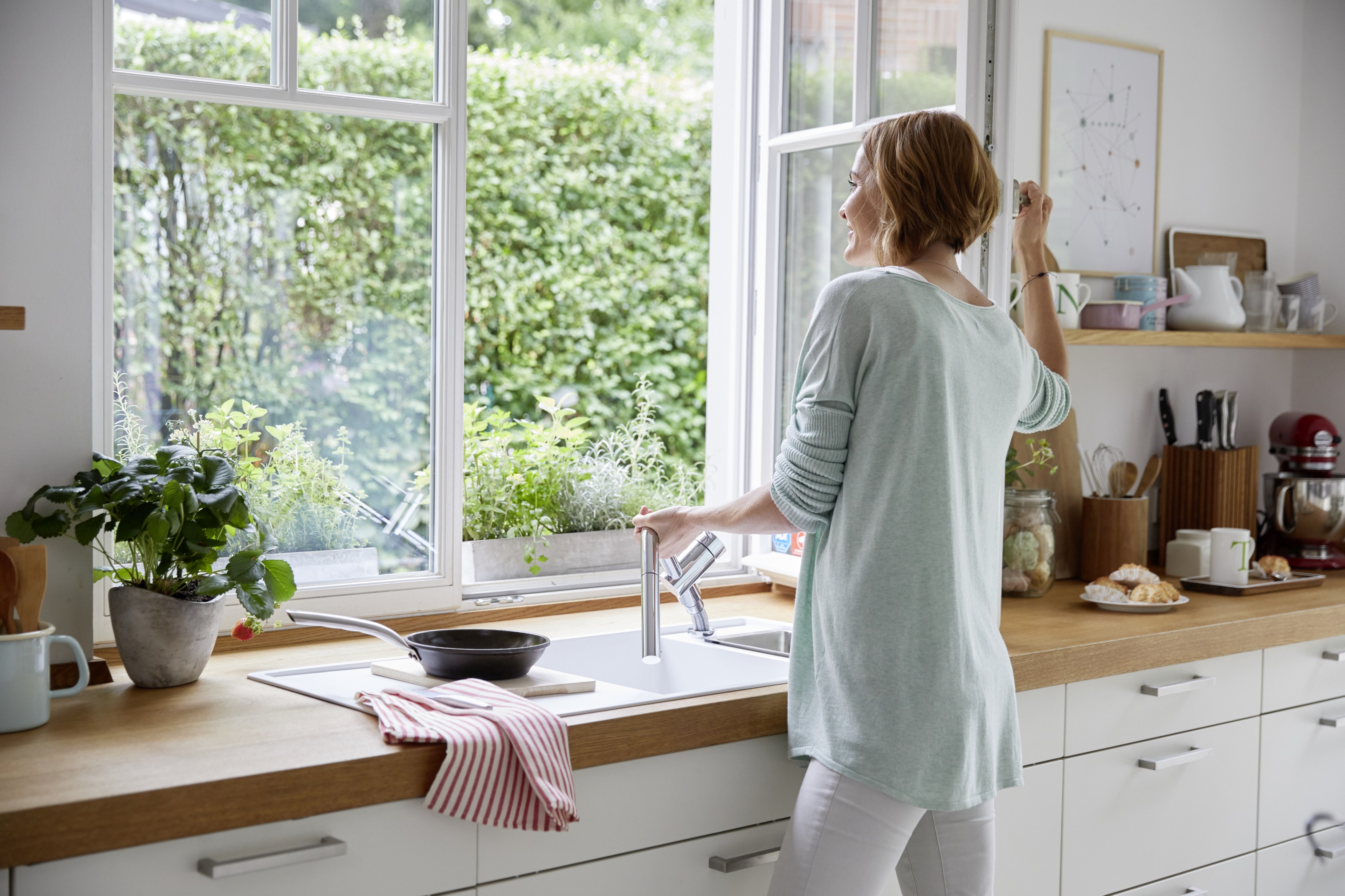 Make the most of the nicest place in the kitchen with a below-window mixer tap.