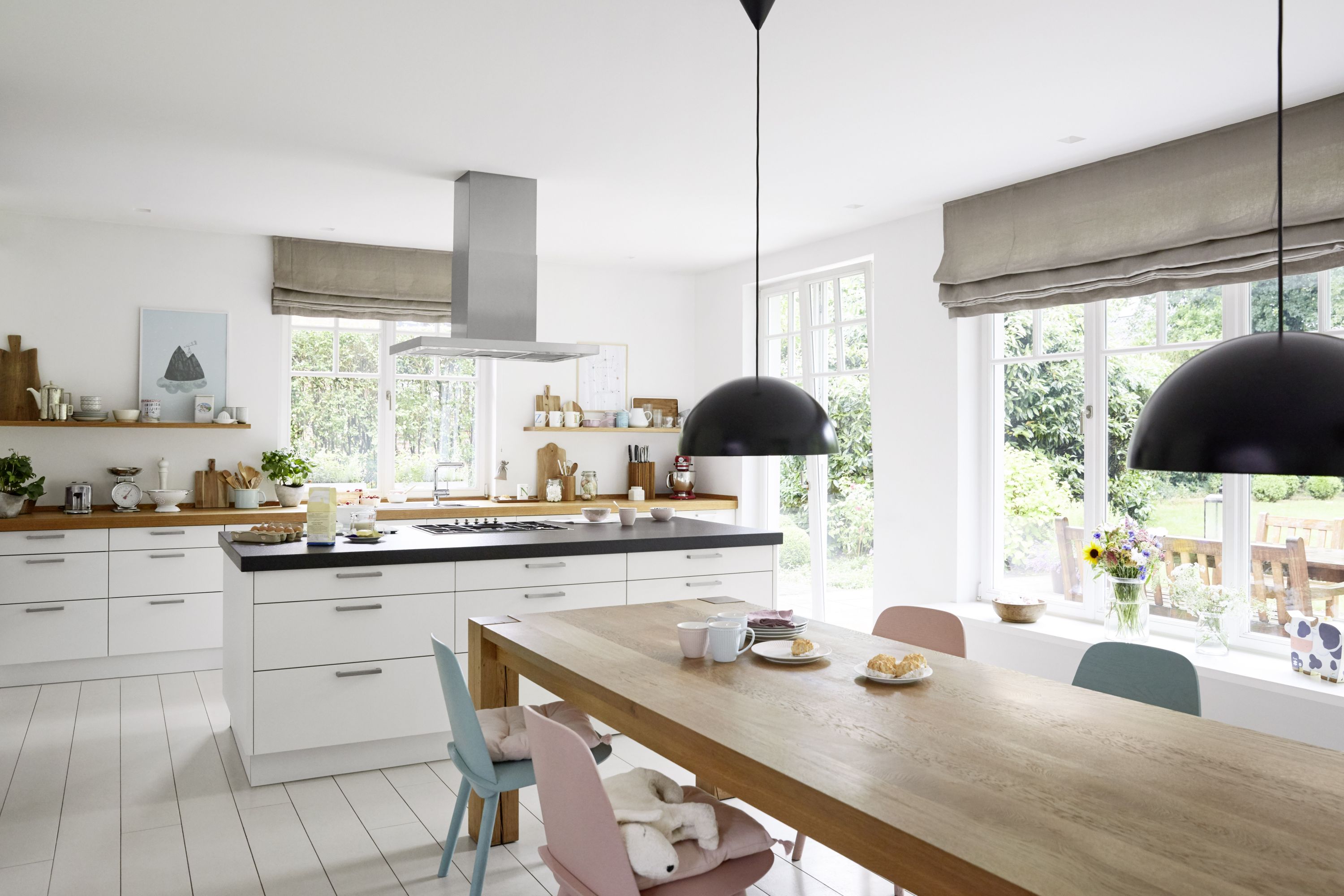 a modern kitchen with an open view into the back yard