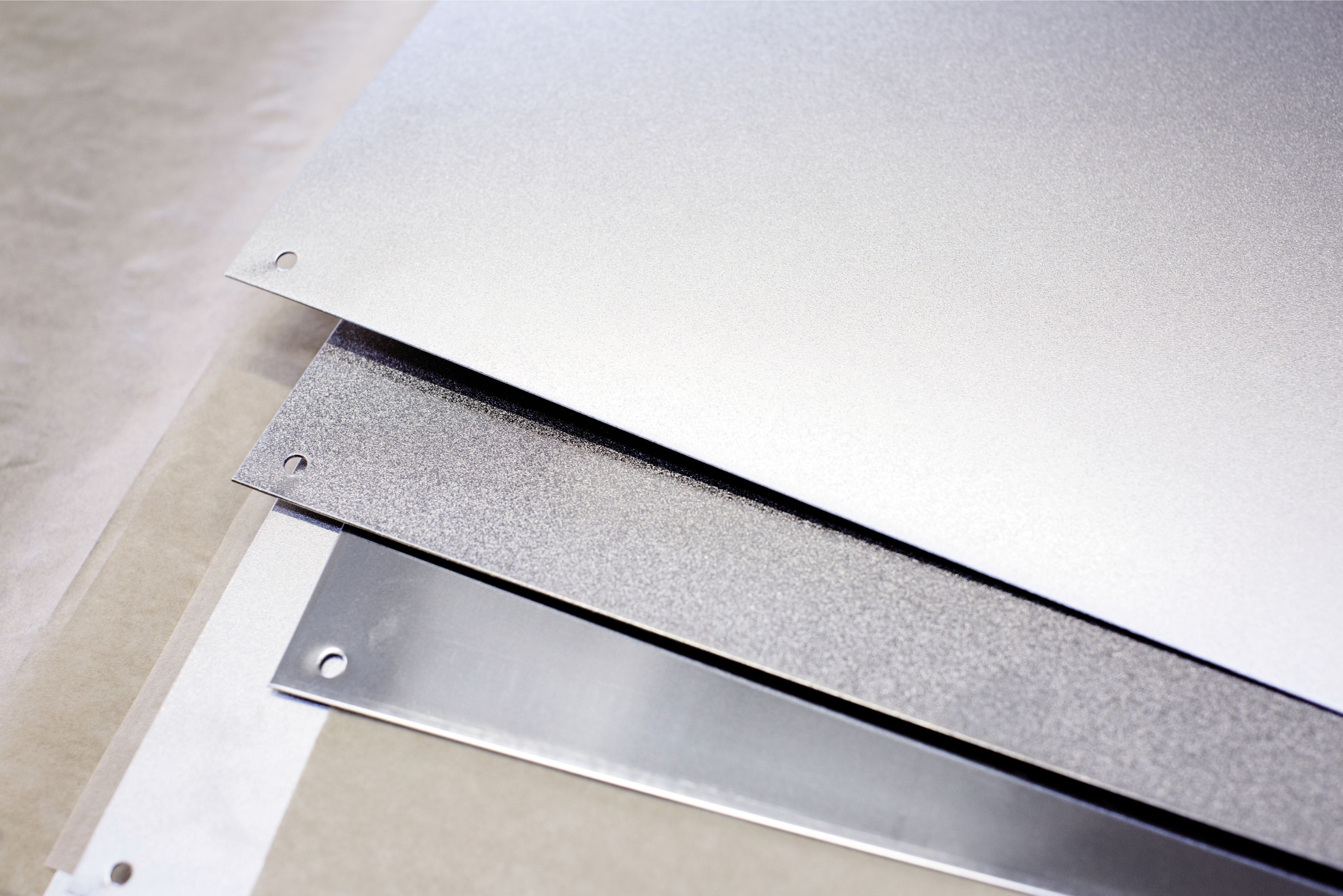 Three stainless steel surfaces in comparison