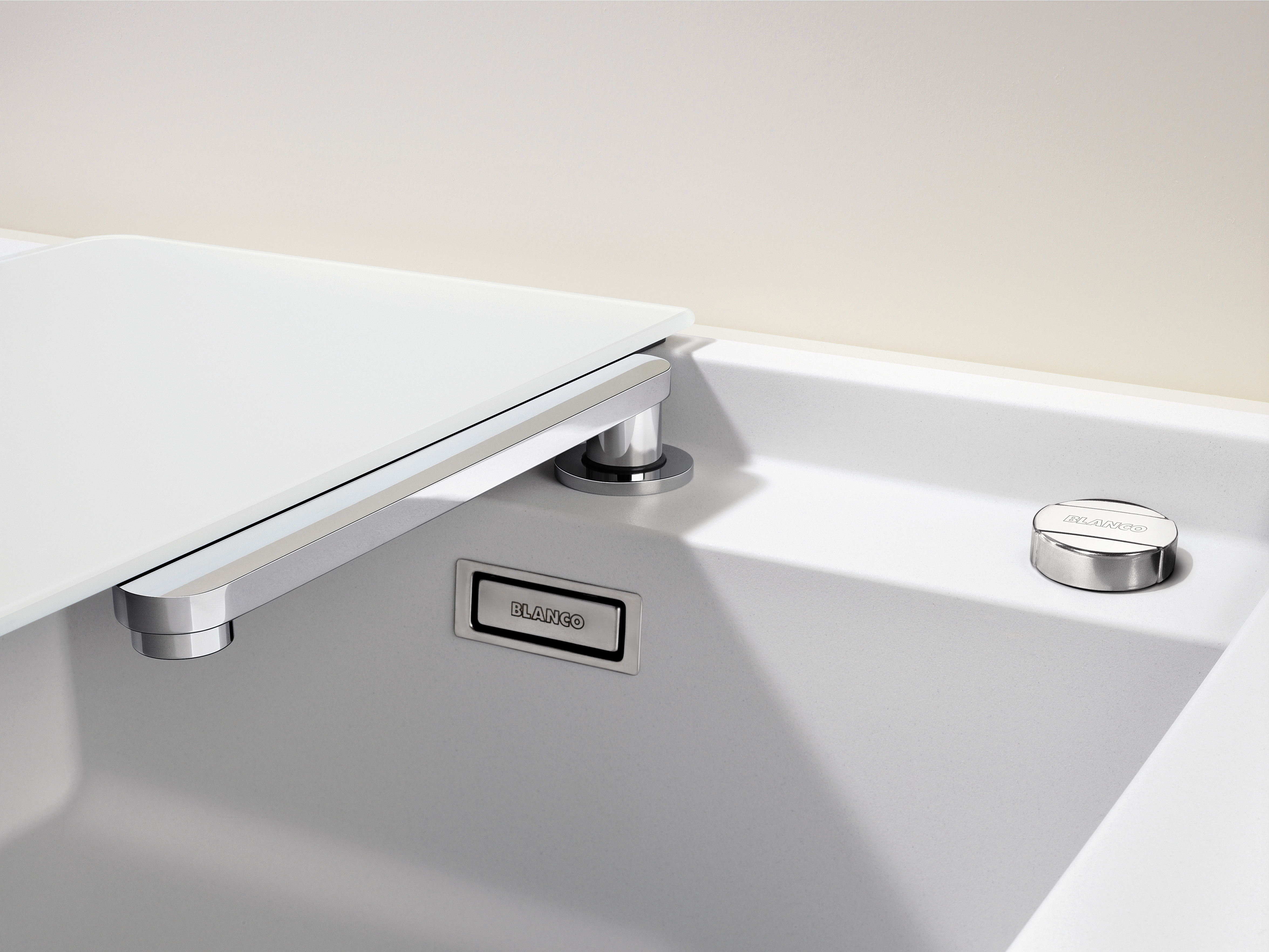 The ALAROS in white Silgranit Ideal for bright kitchens and hidden retractable mixer taps