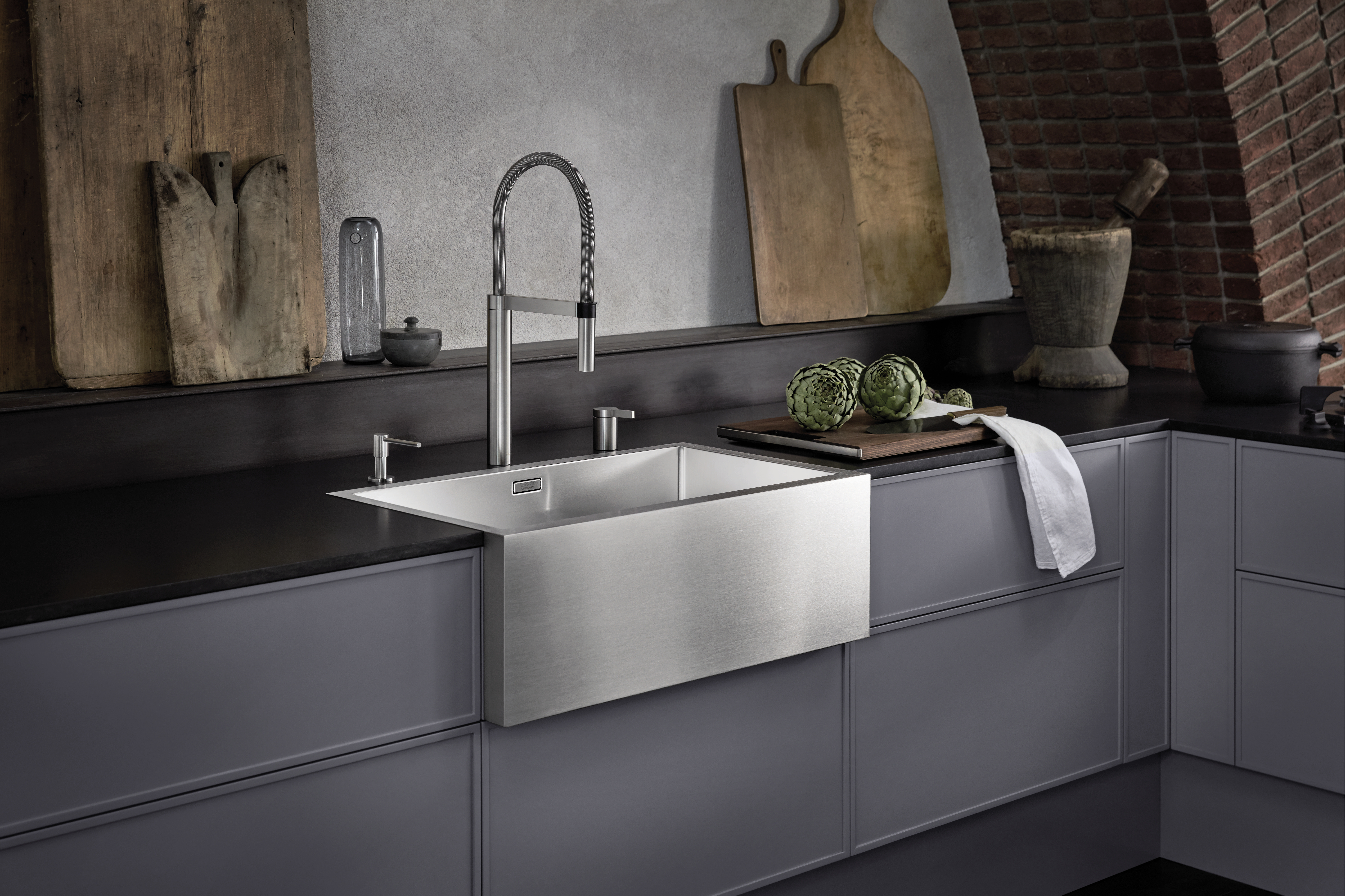 Stainless steel farmhouse-style sink meets history